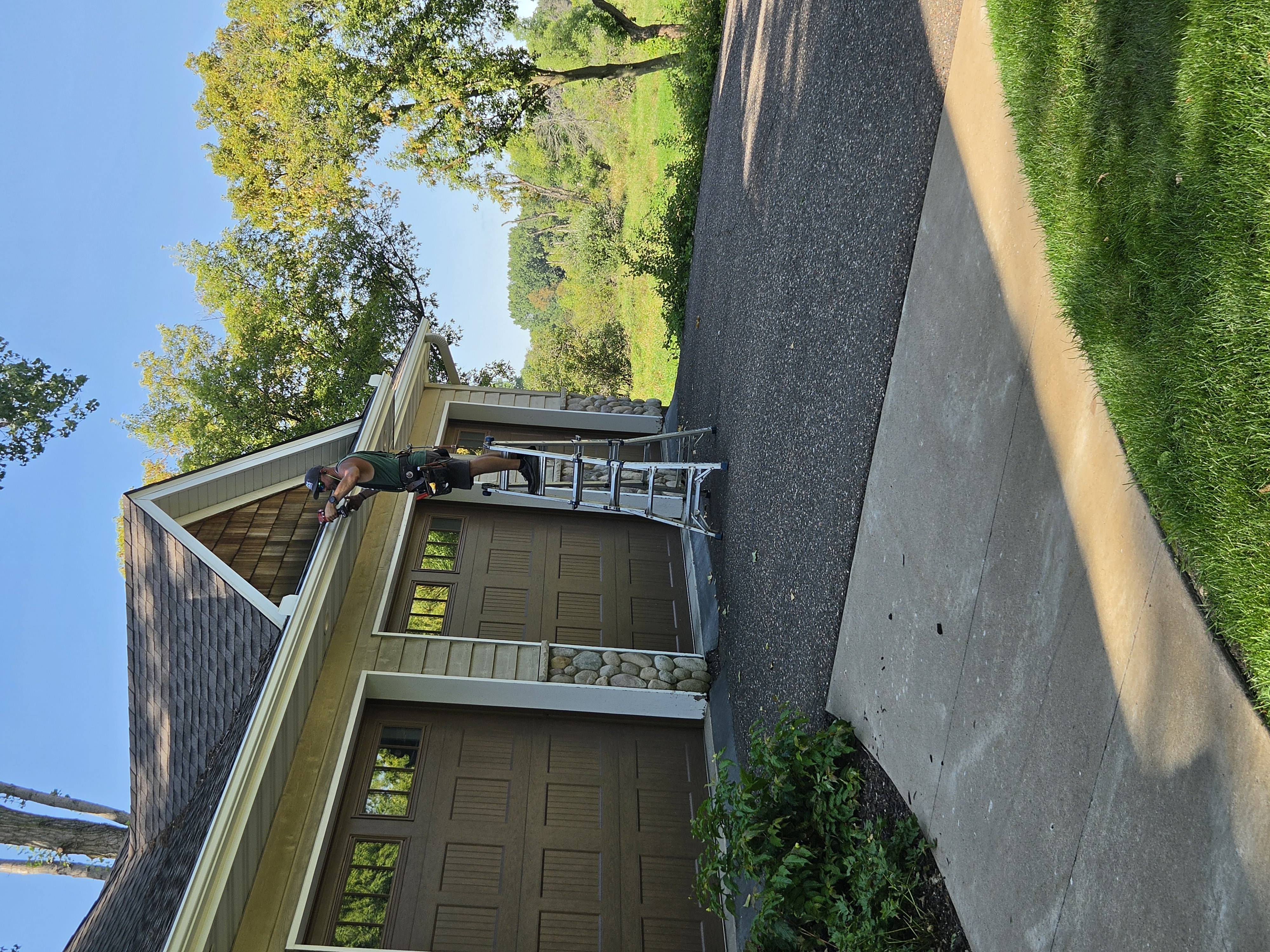 Angled view of a home's garage roofline and gutter installation