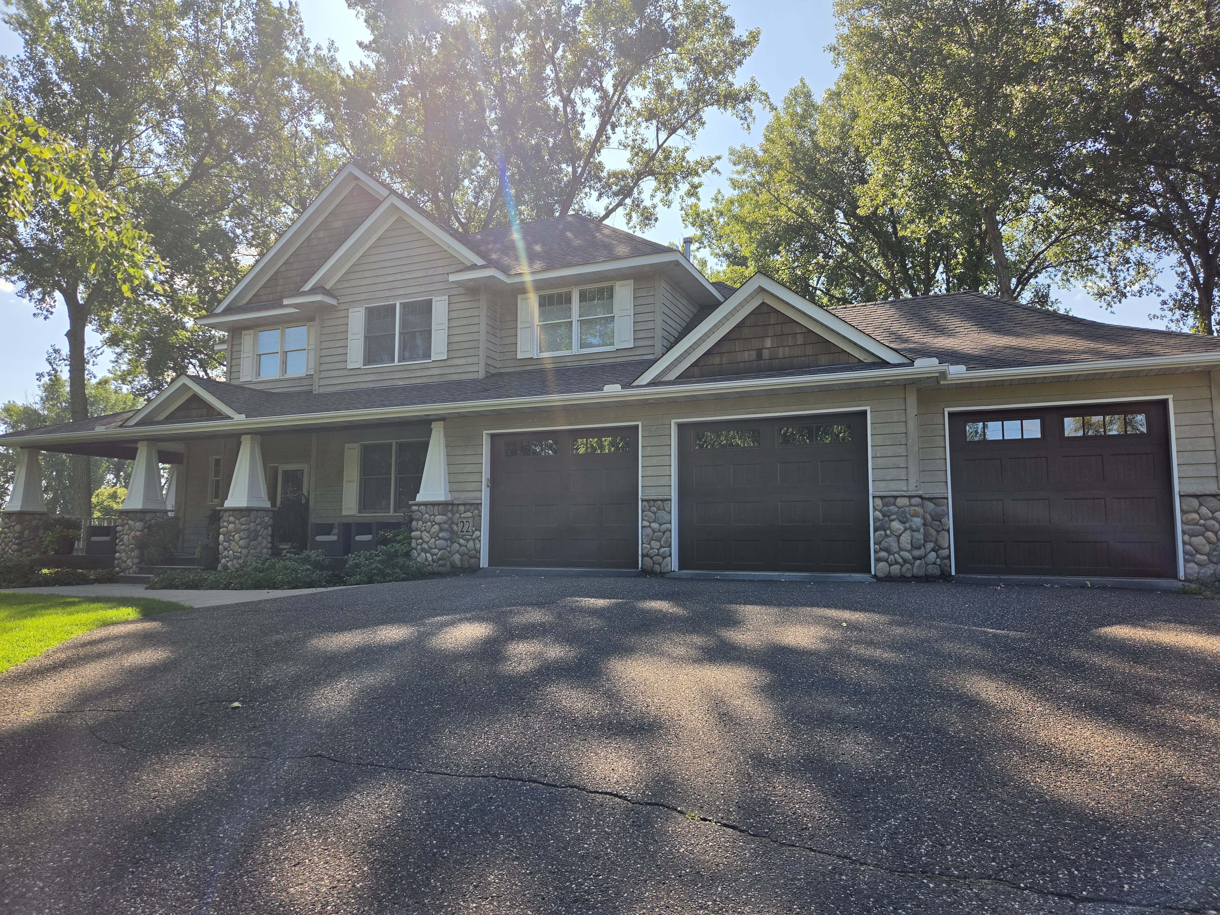 Front view of a two-story home with gutters along the roofline
